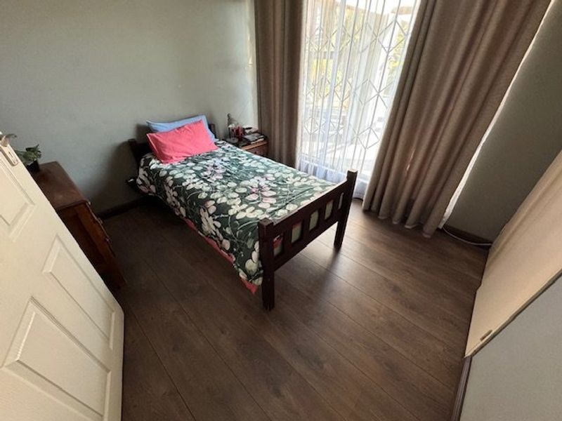 Expansive Seven-Bedroom Home with Pool and Triple Garage - Photo 10