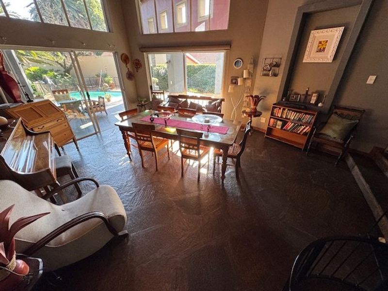 Expansive Seven-Bedroom Home with Pool and Triple Garage - Photo 8