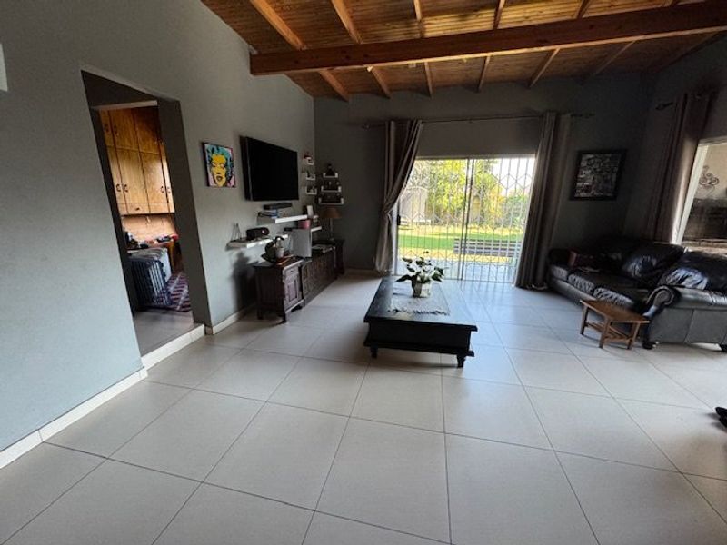 Expansive Seven-Bedroom Home with Pool and Triple Garage - Photo 7