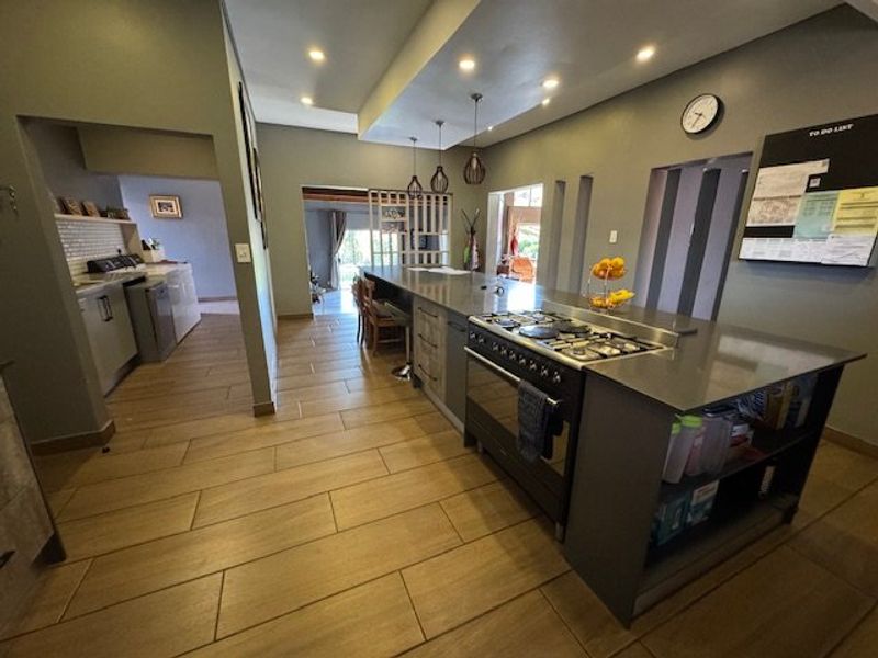 Expansive Seven-Bedroom Home with Pool and Triple Garage - Photo 4