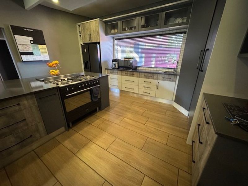 Expansive Seven-Bedroom Home with Pool and Triple Garage - Photo 5