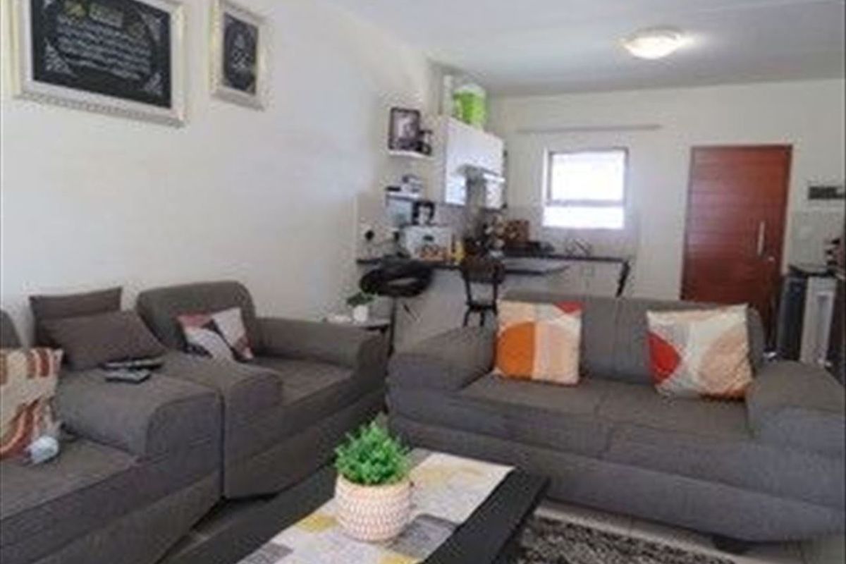 Cozy Two-Bedroom Home with Modern Comforts - Photo 2