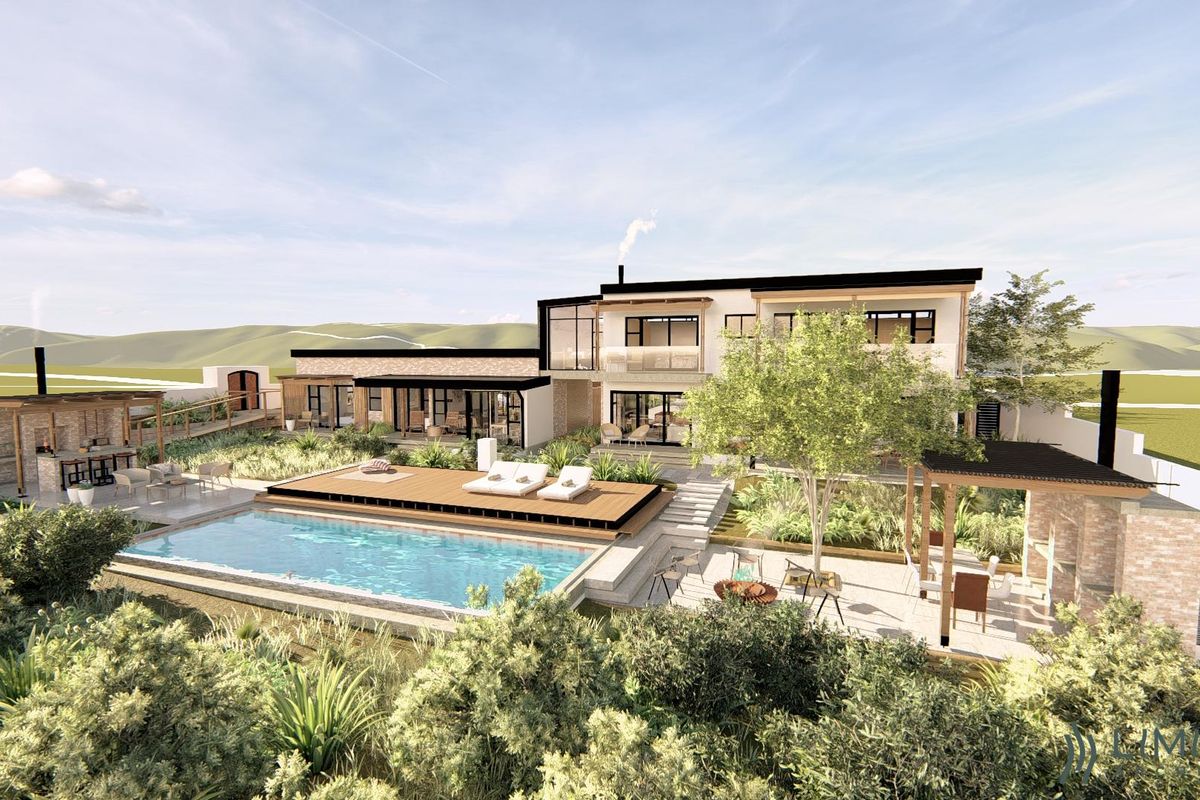 A high-end residential rear exterior featuring a swimming pool, timber deck, stone fireplace, and landscaped garden, showcasing modern architectural design.