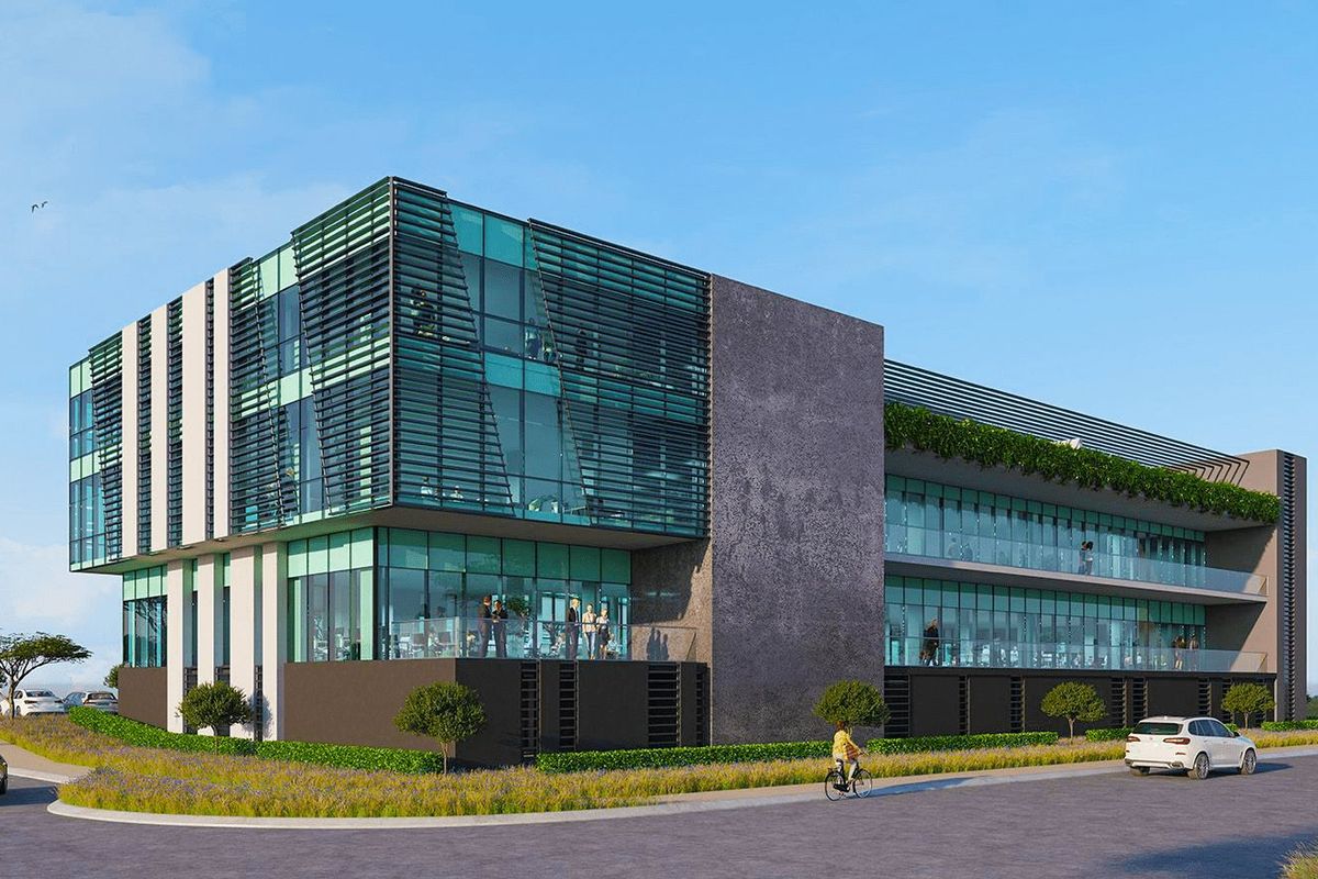 Modern commercial office building featuring a contemporary glass facade, integrated sun shading, and multi-level balconies with glass balustrades.