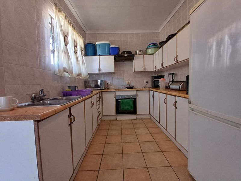 Spacious and Secure Family Home with Dual Access in Stilfontein - Photo 10