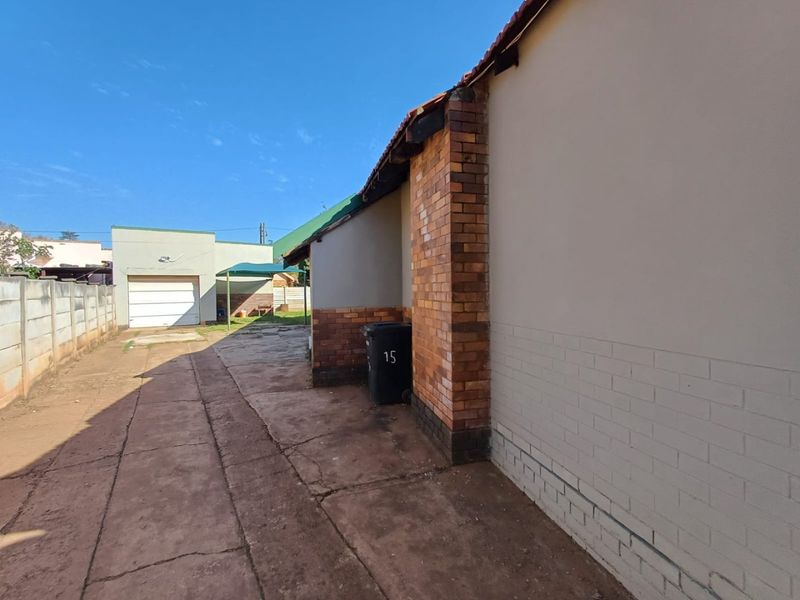 Spacious and Secure Family Home with Dual Access in Stilfontein - Photo 6