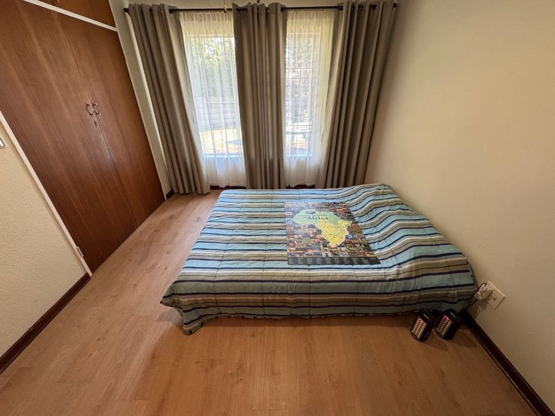 Elegant Four-Bedroom Home with Pool and Ample Storage - Photo 10