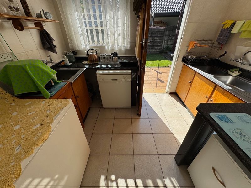 Elegant Four-Bedroom Home with Pool and Ample Storage - Photo 8