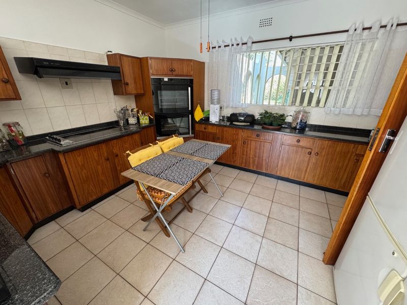 Elegant Four-Bedroom Home with Pool and Ample Storage - Photo 7