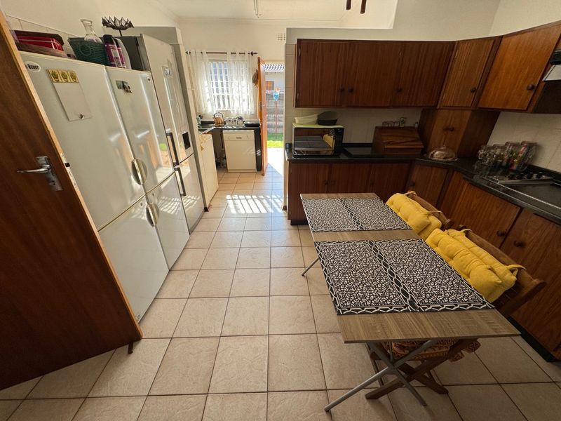 Elegant Four-Bedroom Home with Pool and Ample Storage - Photo 6