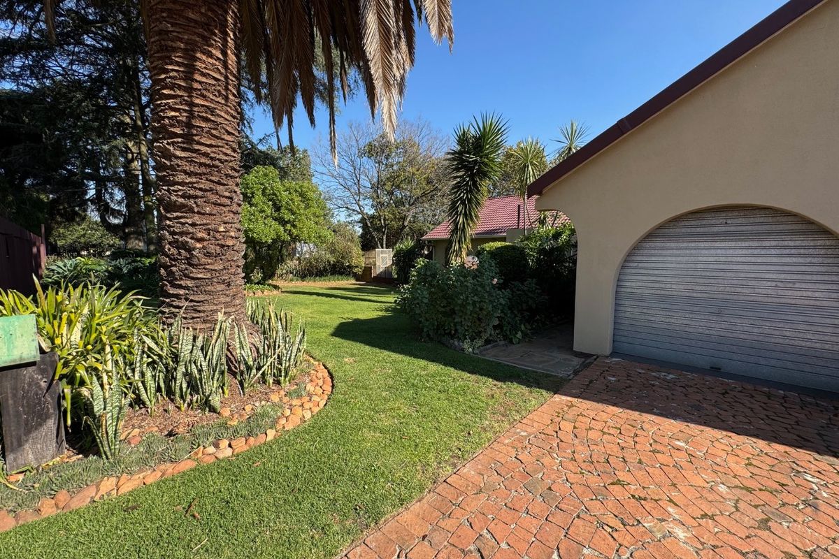 Elegant Four-Bedroom Home with Pool and Ample Storage - Photo 2