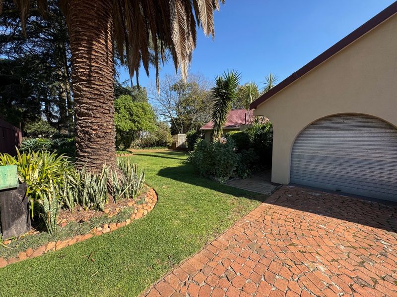 Elegant Four-Bedroom Home with Pool and Ample Storage - Photo 2