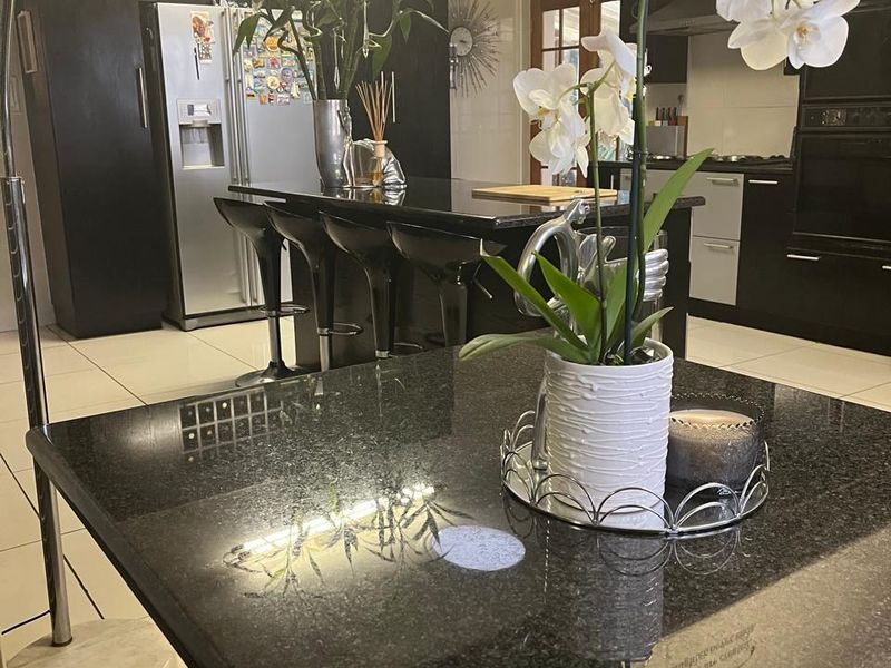 Elegant Double-Story Family Home in Garden Oasis - Photo 5