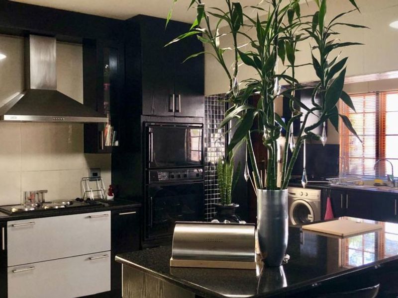 Elegant Double-Story Family Home in Garden Oasis - Photo 4