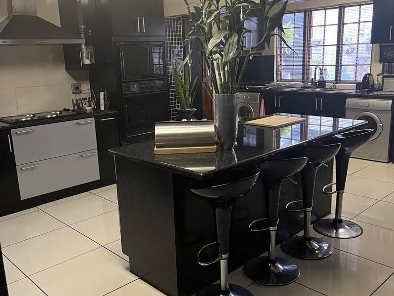 Elegant Double-Story Family Home in Garden Oasis - Photo 6