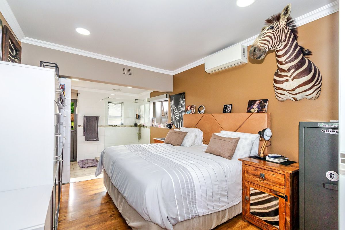 Discover this spacious and secure family home located near top schools - Photo 3