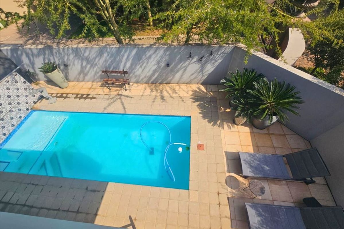 Luxurious Four-Bedroom Home with Pool and Premium Features - Photo 3