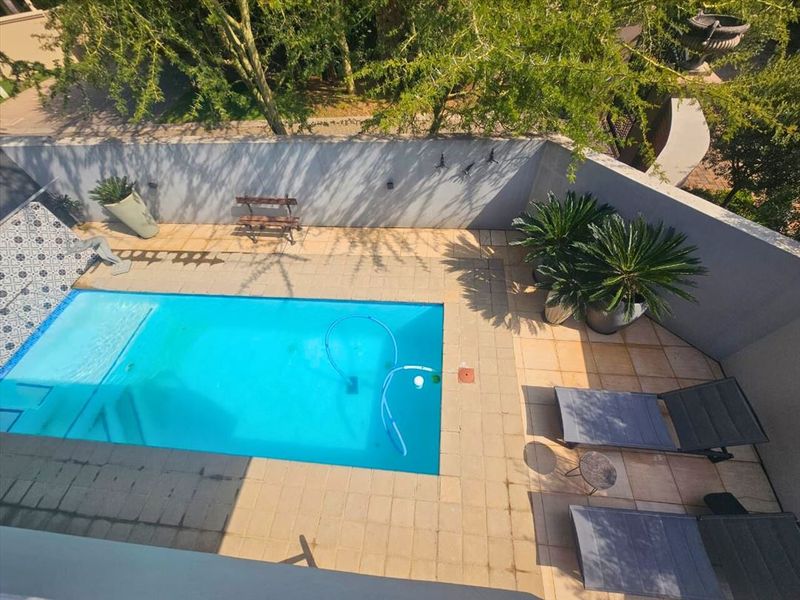 Luxurious Four-Bedroom Home with Pool and Premium Features - Photo 3