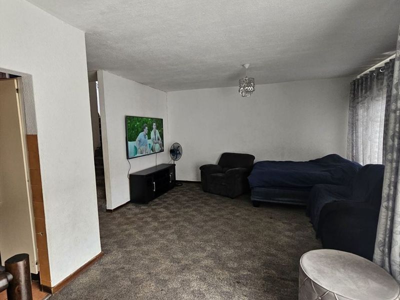 Charming Two-Bedroom Home with Garage and Carport - Photo 2