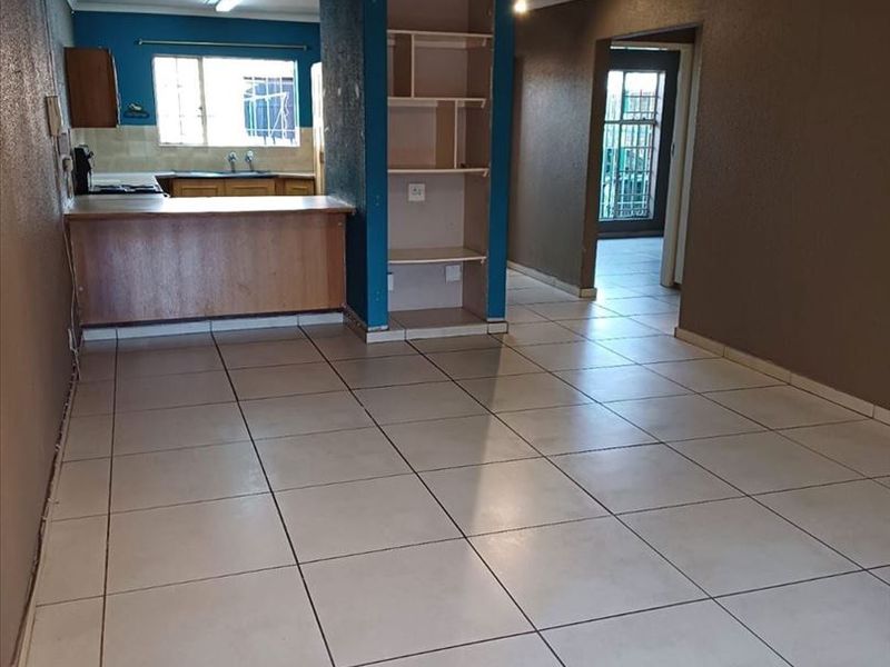 Cozy Two-Bedroom Starter Home with Carport - Photo 2