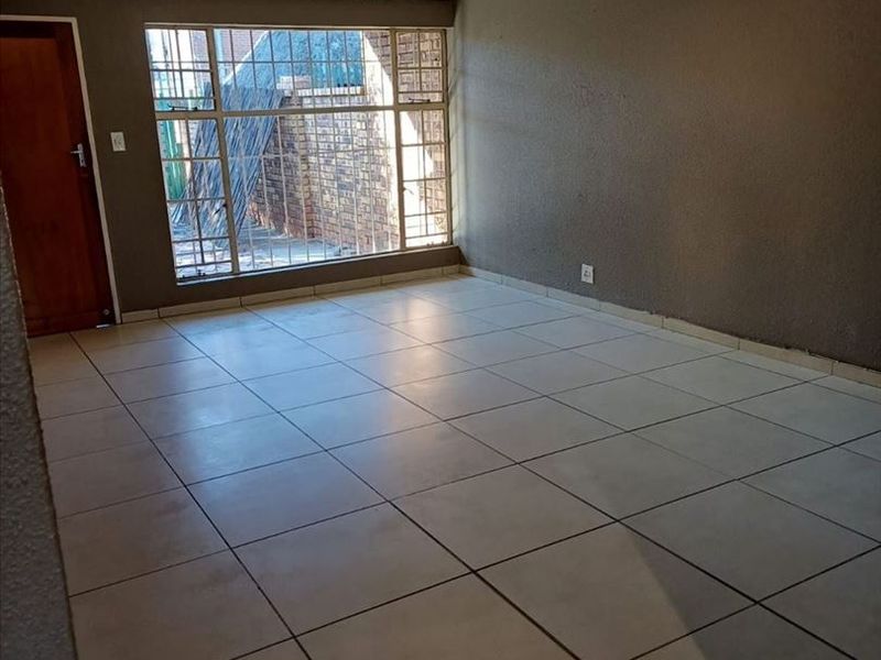 Cozy Two-Bedroom Starter Home with Carport - Photo 3