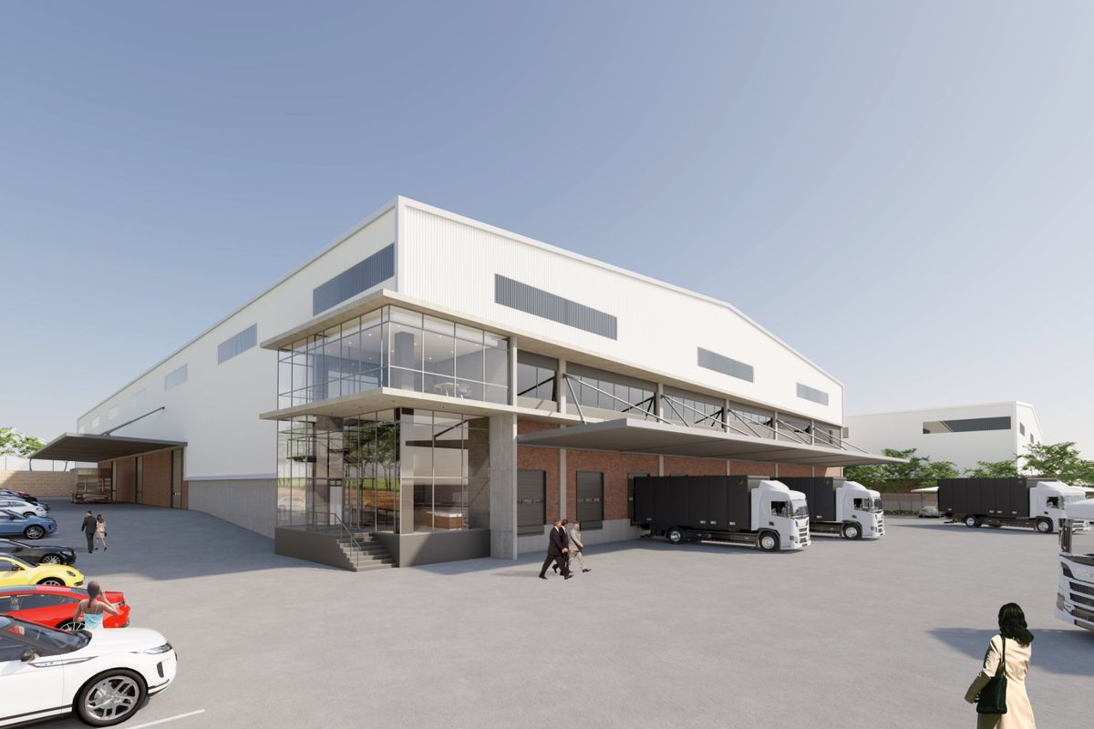 Modern industrial warehouse facility featuring a glass-fronted office section, multiple loading docks, and extensive concrete hardstand area for logistics operations.