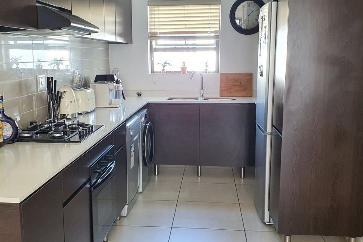 Modern 2-Bed, 2-Bath Gem with Appliances & Top-Tier Security in Greenstone Ridge - Photo 2