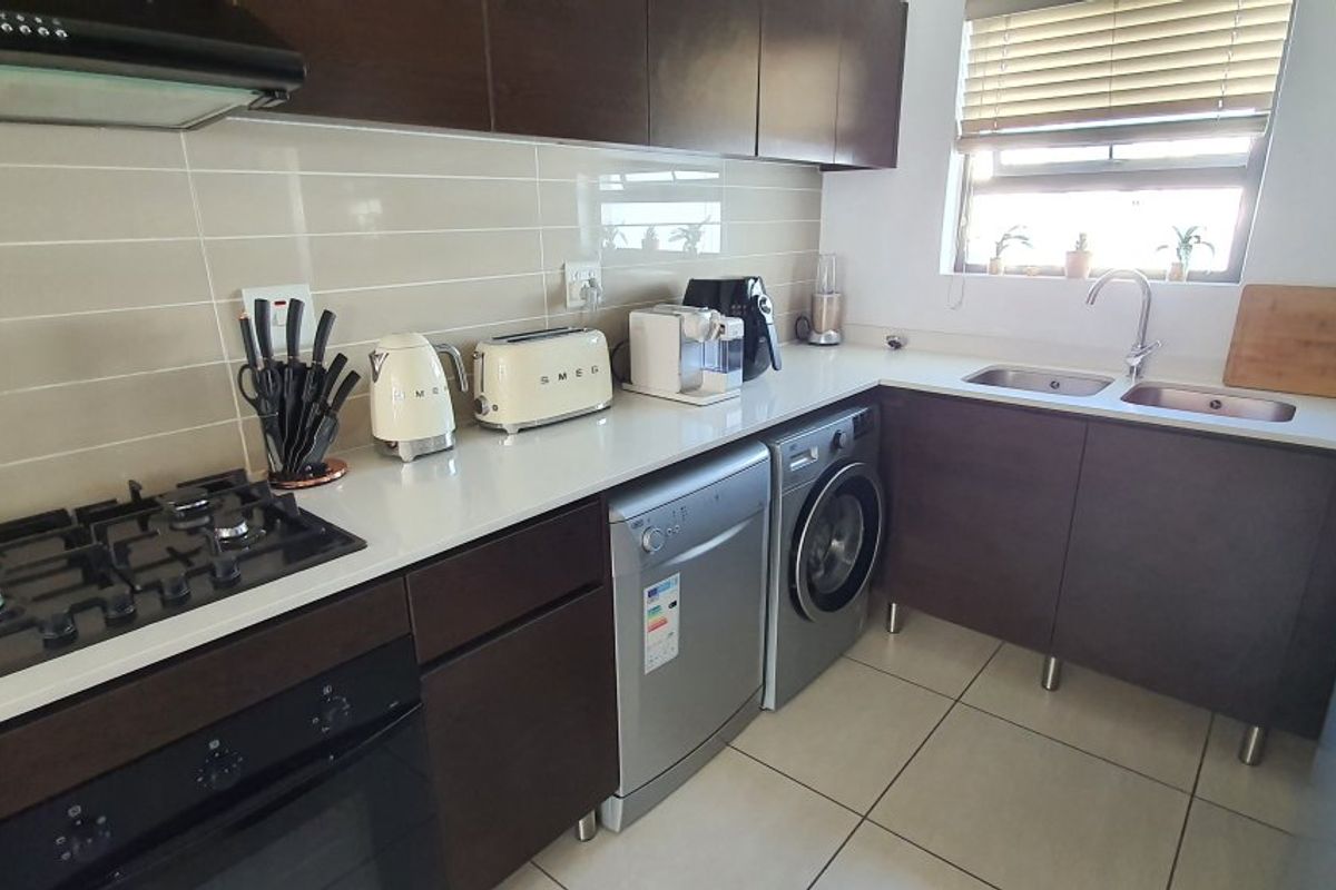 Modern 2-Bed, 2-Bath Gem with Appliances & Top-Tier Security in Greenstone Ridge - Photo 3