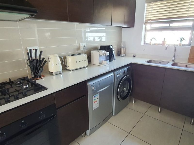 Modern 2-Bed, 2-Bath Gem with Appliances & Top-Tier Security in Greenstone Ridge - Photo 3