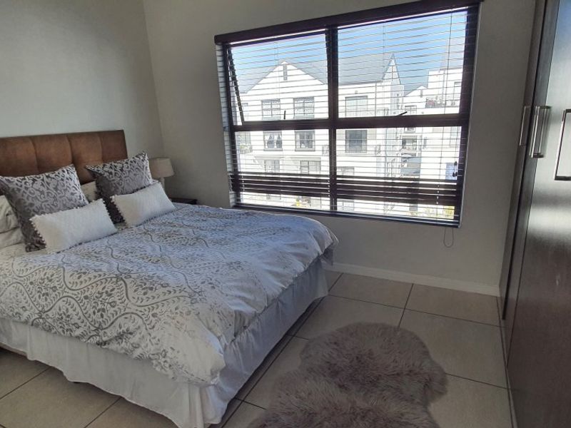 Modern 2-Bed, 2-Bath Gem with Appliances & Top-Tier Security in Greenstone Ridge - Photo 7