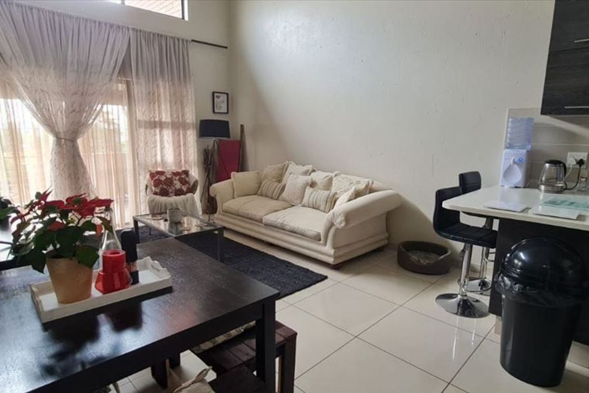 Comfortable Three-Bedroom Home with Carport - Photo 2