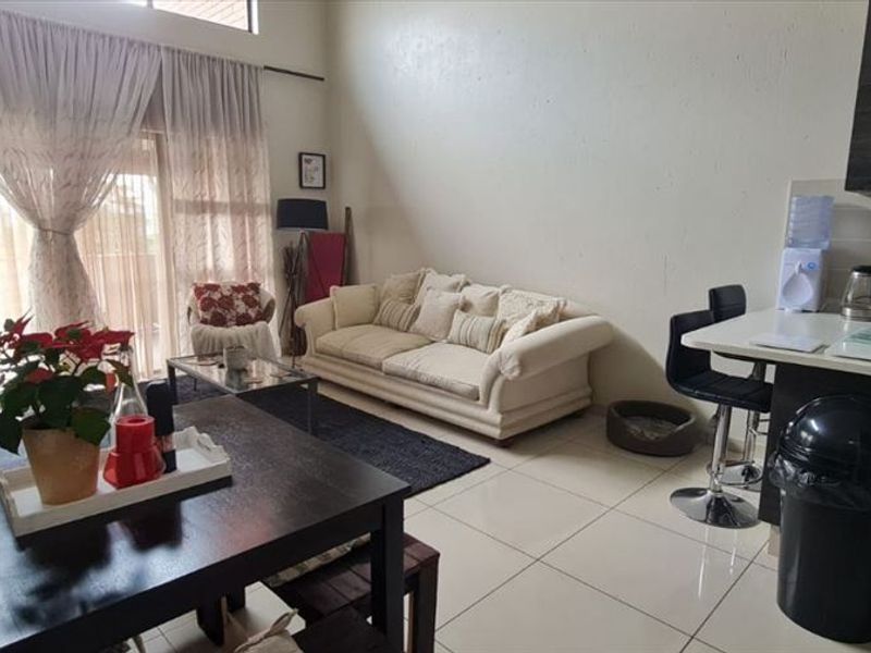 Comfortable Three-Bedroom Home with Carport - Photo 2