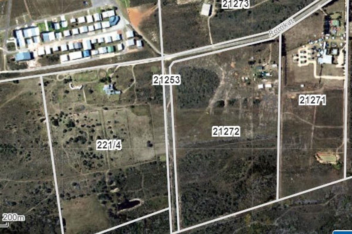 An aerial view showing the layout and boundaries of vacant residential land plots in a rural setting.