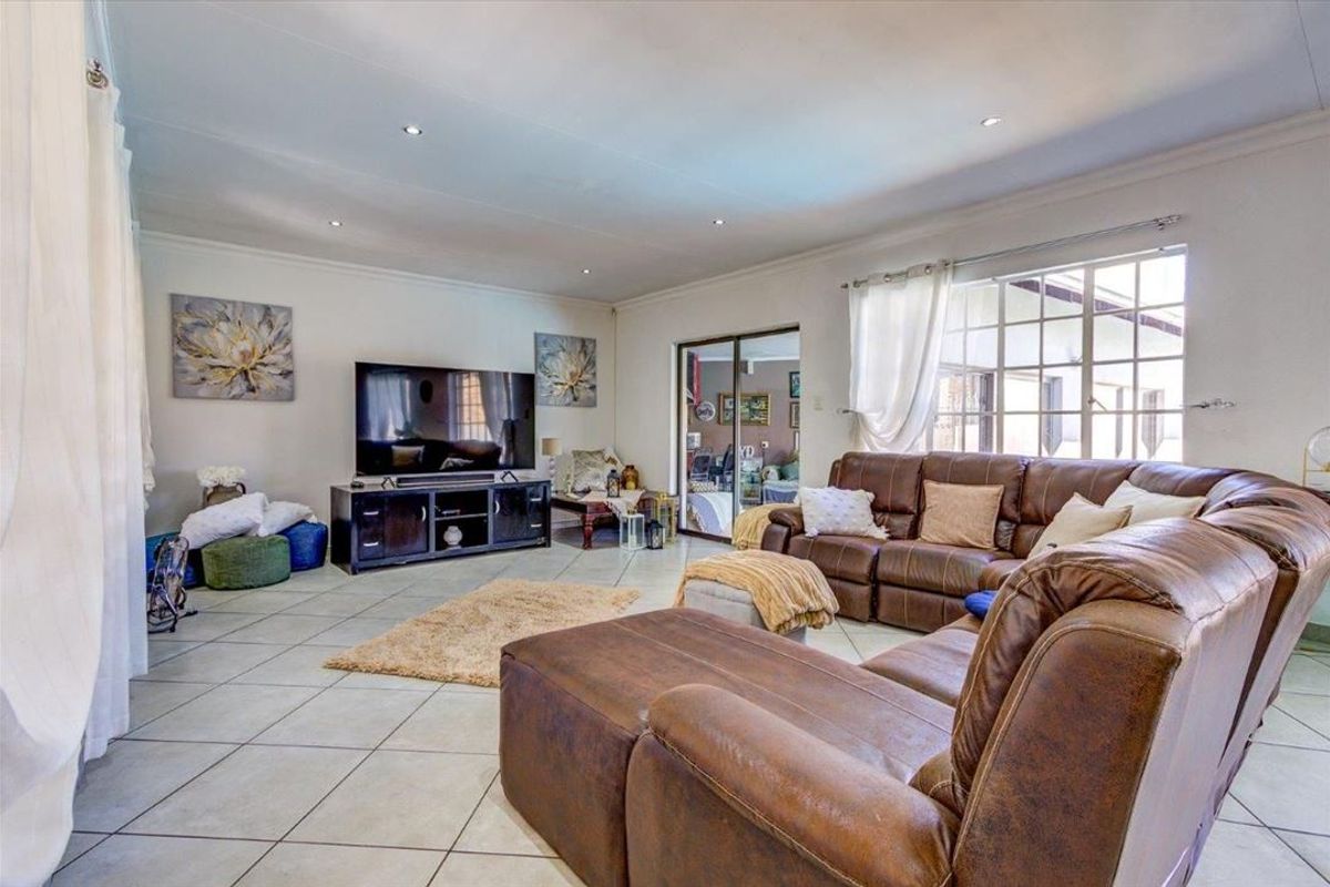 Elegant Four-Bedroom Home with Premium Features - Photo 2