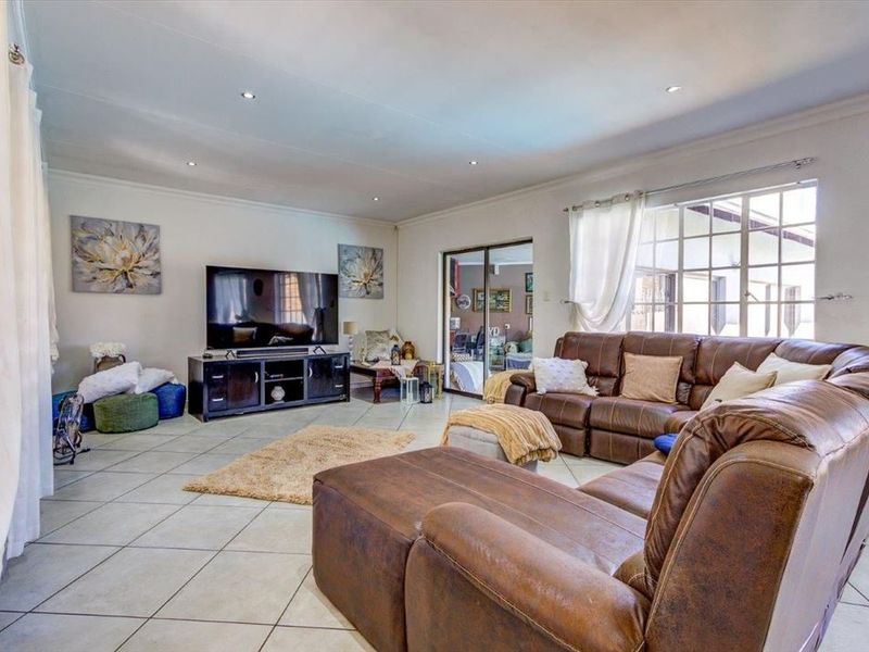 Elegant Four-Bedroom Home with Premium Features - Photo 2