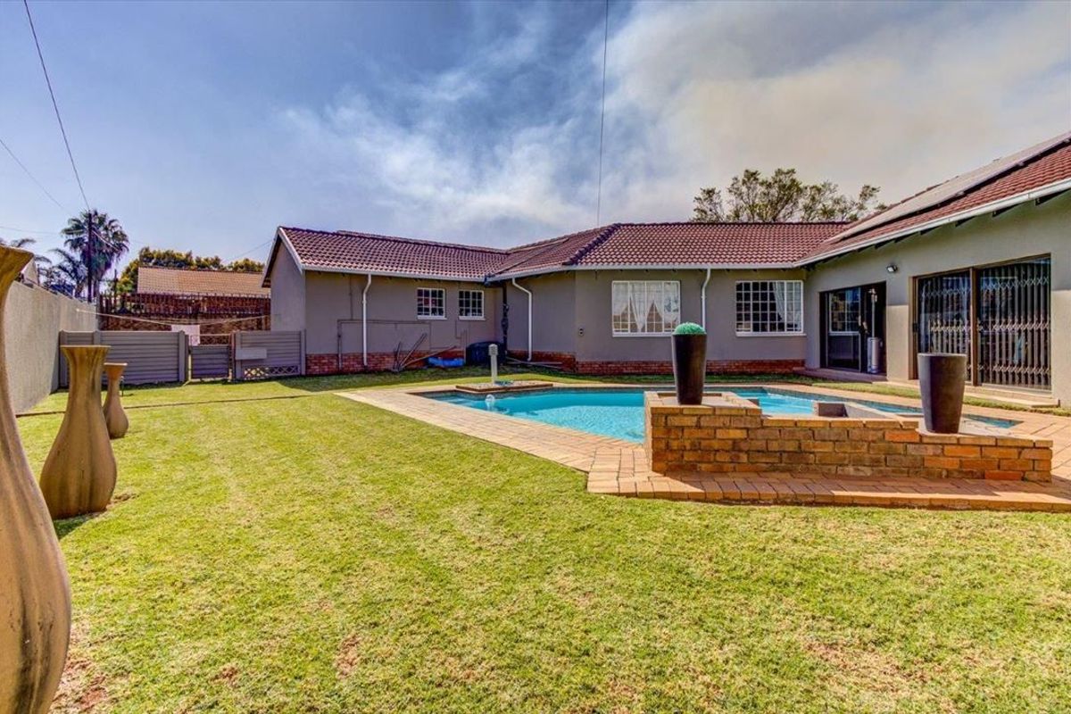 Elegant Four-Bedroom Home with Premium Features - Photo 3