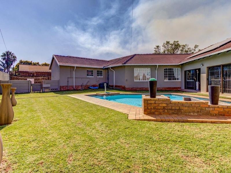 Elegant Four-Bedroom Home with Premium Features - Photo 3