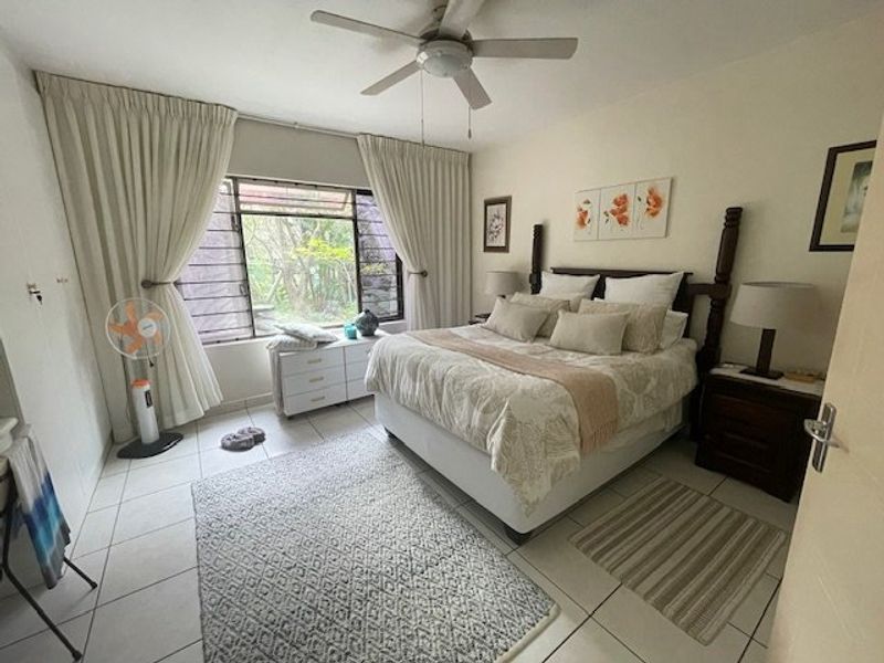 Spacious 4-Bedroom Ground Floor Corner Unit in Tranquil Uvongo Setting - Photo 3