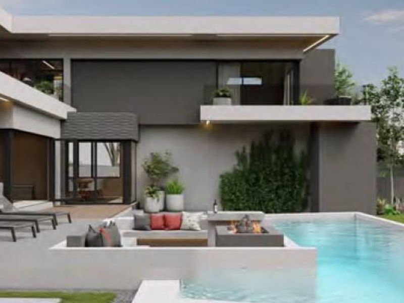 Modern outdoor living space featuring a swimming pool, sunken seating area with a built-in fire pit, and a contemporary architectural design.