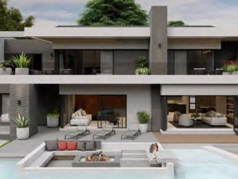 Modern luxury rear elevation featuring a swimming pool, sunken fire pit, expansive covered patio, and seamless indoor-outdoor flow through large sliding glass doors.