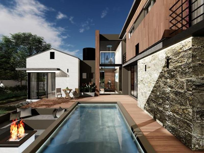 Modern outdoor entertainment area featuring a swimming pool, timber decking, stone feature wall, and a built-in fire pit.