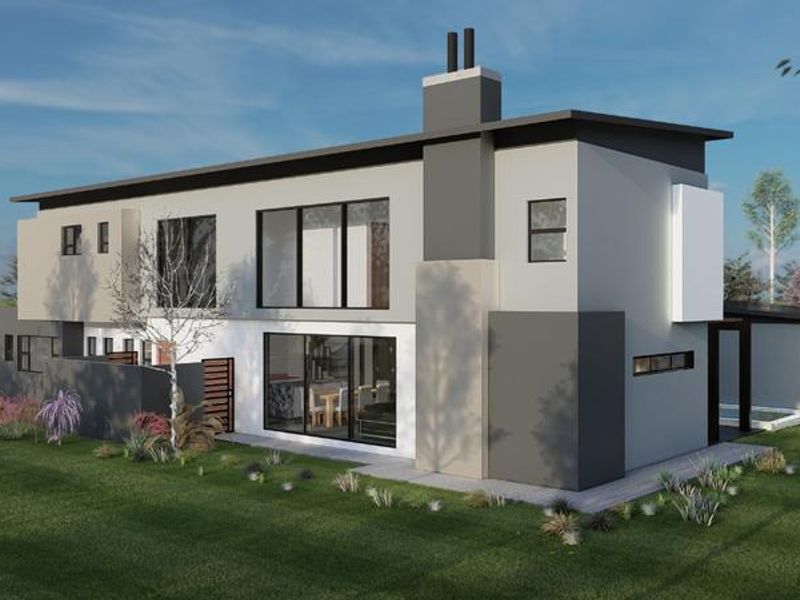 A modern two-story residential property featuring a contemporary facade, large sliding glass doors, and a prominent chimney, set within a landscaped garden.