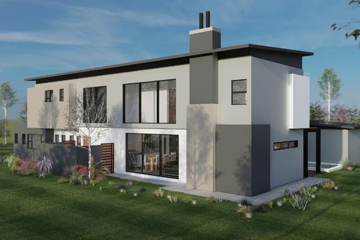 A modern two-story residential property featuring a contemporary facade, large sliding glass doors, and a prominent chimney, set within a landscaped garden.