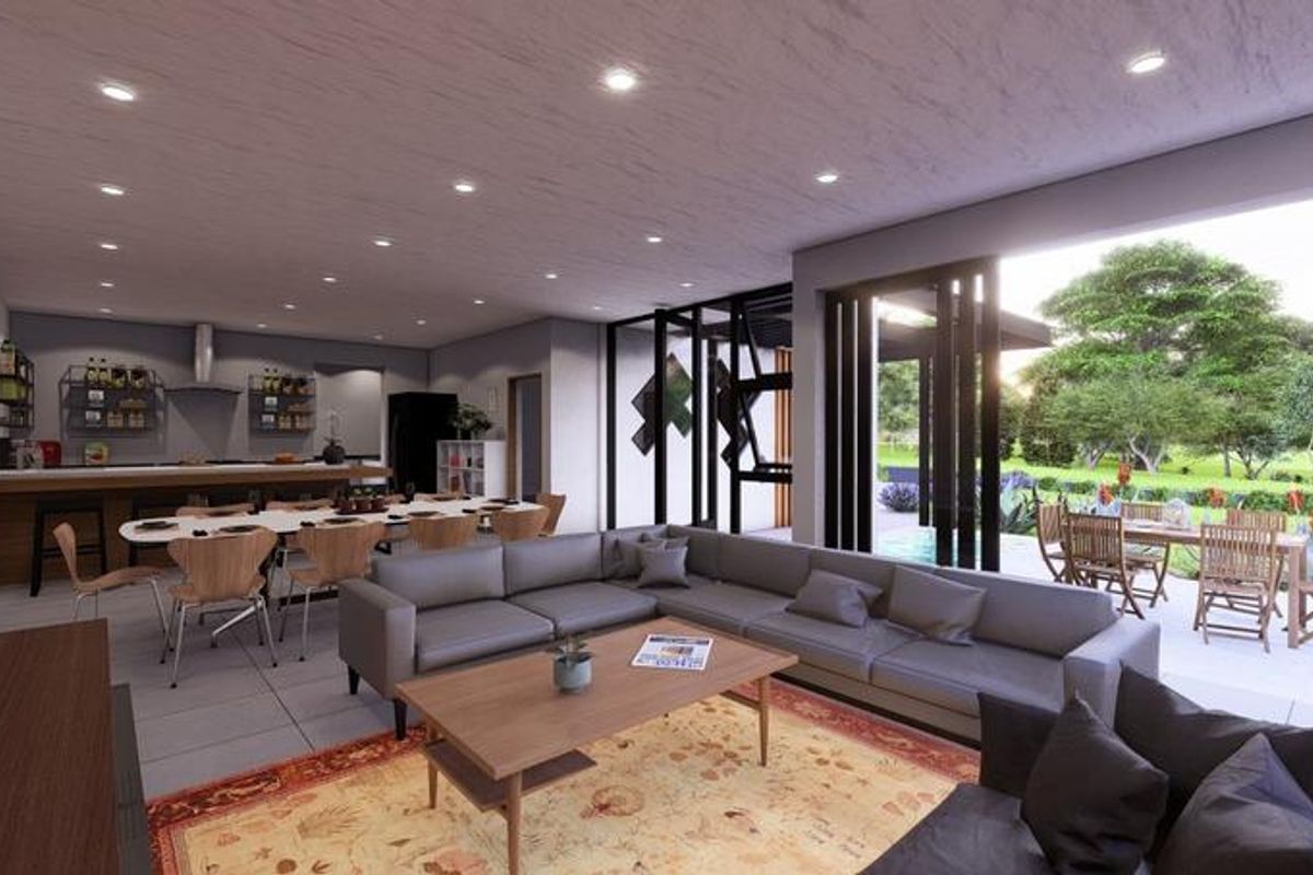 Spacious open-plan living and kitchen area featuring modern finishes, recessed lighting, and seamless indoor-outdoor flow through large sliding glass doors to the patio.