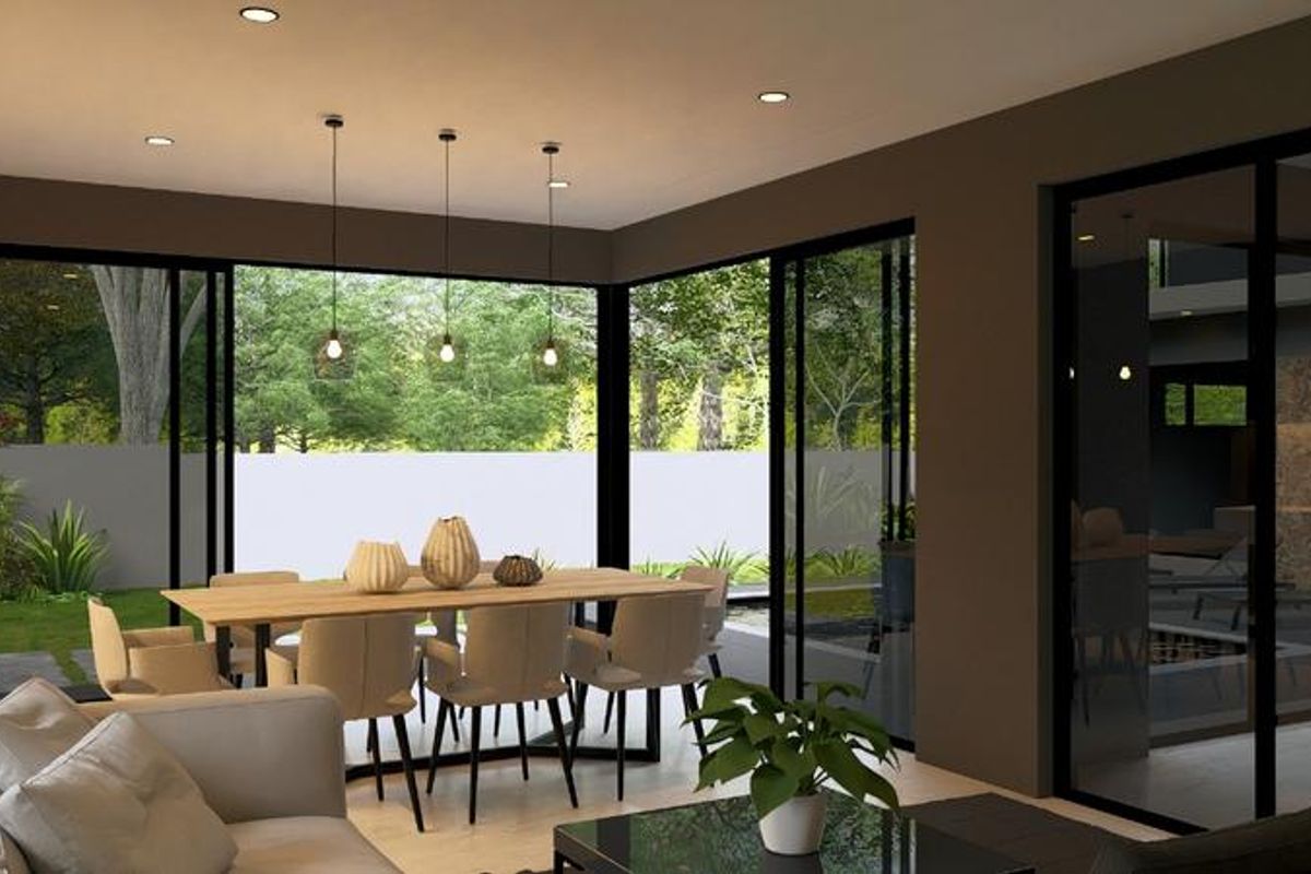 Modern open-plan living and dining area featuring large sliding glass doors that provide seamless access to the garden and abundant natural light.