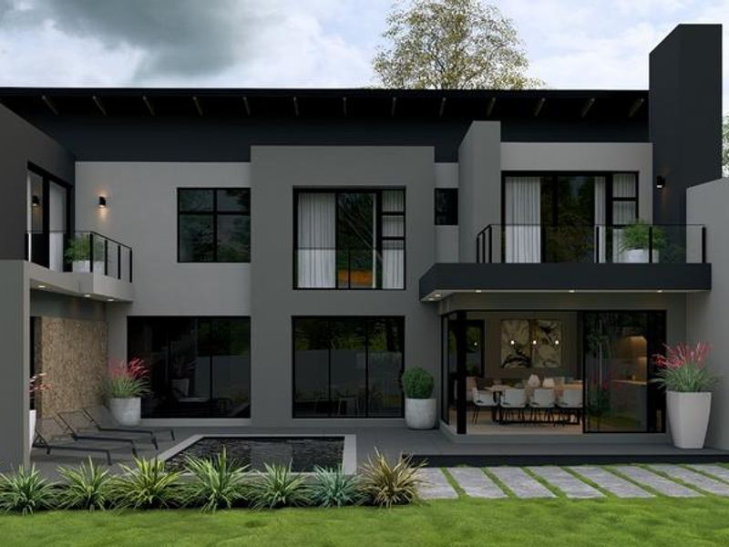 Modern rear elevation featuring a swimming pool, paved patio, glass sliding doors, and upper-level balconies with contemporary architectural finishes.