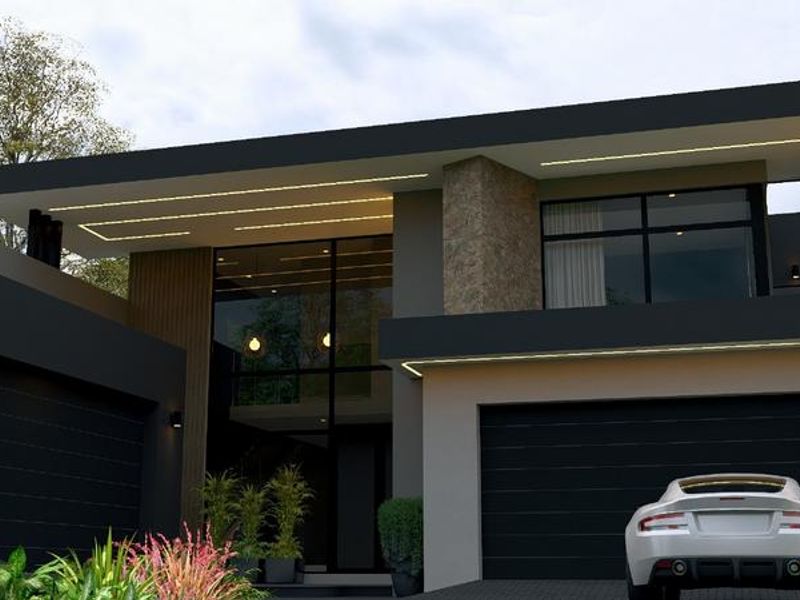 Modern double-story residence featuring a striking dark facade, stone accents, integrated LED lighting, and a spacious double garage.