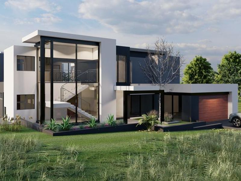 A modern double-storey architectural home featuring expansive floor-to-ceiling glass windows, a sleek facade, and an integrated garage.