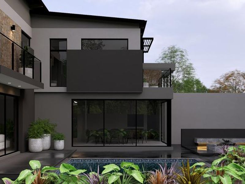 Modern rear exterior featuring a swimming pool, built-in fire pit area, and upper-level balcony with contemporary stone and dark frame finishes.