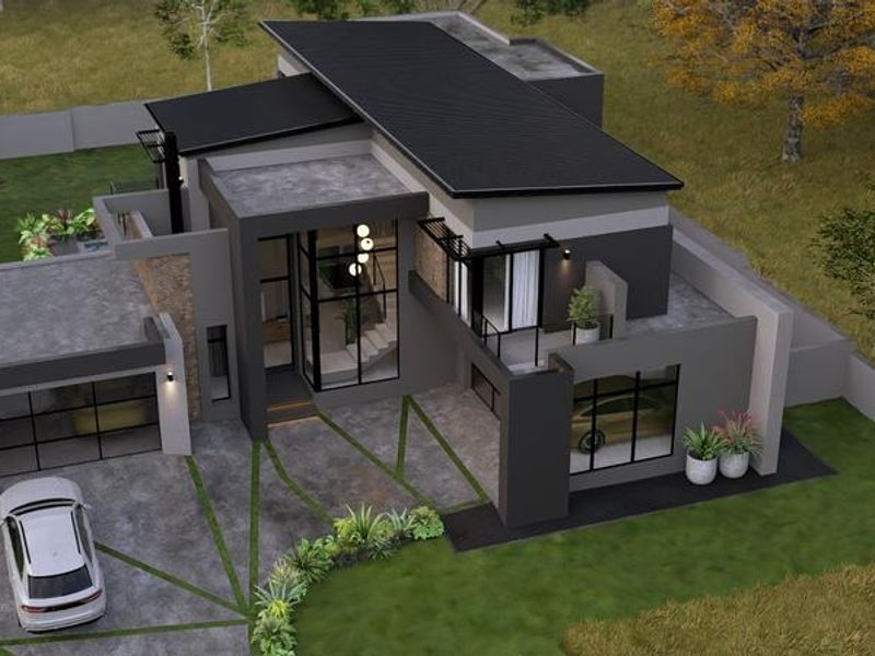 An aerial view of a modern architectural house design featuring a sleek metal roof, large glass windows, and a paved driveway.